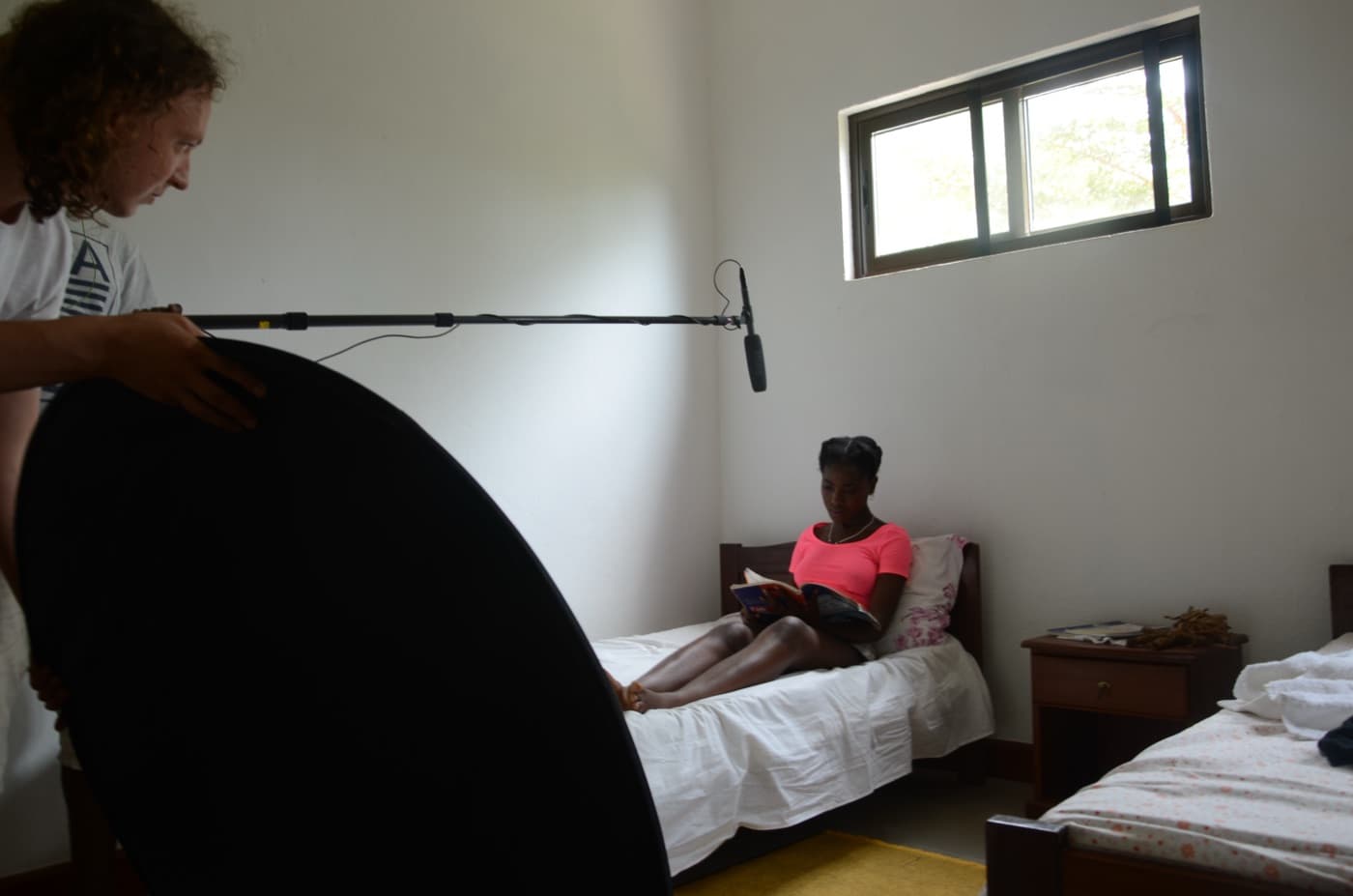 Mina Kia production still — on-set portrait